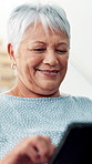 Senior woman, tablet and relax in home with smile, search of choice for ebook in lounge. Elderly person, digital touchscreen and app for streaming subscription with decision for movie in retirement