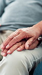 Holding hands, senior couple and home with love, comfort and compassion with support. Closeup, marriage and man with woman, apartment and kindness with empathy, retirement and affection with trust