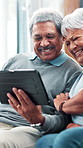 Senior couple, tablet and laugh on couch with pictures, memory or funny video on web in living room. People, man and woman with digital touchscreen with app, streaming or social media in retirement