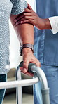 Nurse, senior person and help with walker for balance, steps and healing with physiotherapy at clinic. People, caregiver and patient with disability, frame and rehabilitation process for recovery