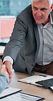 Handshake, meeting and business people in office with contract, negotiation or deal for investment. Applause, introduction and mature investor shaking hands with client for finance partnership.