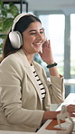 Headphones, music and business woman in office for dance, streaming song and typing creative article. Radio, technology and happy worker listen to favorite sound, album or audio critic writing review