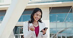 Business, woman and celebration with phone outdoor for good news, promotion email and corporate milestone. Professional, employee and victory fist in city for job opportunity, excited and success