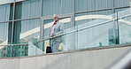 Thinking, hotel and business man on balcony for accommodation, convention and company trip. Professional, corporate and person by building outdoor for planning, inspiration and career opportunity