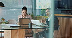 Business, people and documents with laptop in office for kpi performance, financial report and research. Staff, talking and online with paperwork of budget planning, teamwork and  investment feedback