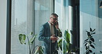 Walking, businessman and phone call in corporate for financial development, investment and deal. Manager, glass or investor talking on mobile communication for finance, funding or budget negotiation 