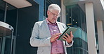 Business, tablet and man in city, internet and real estate agent with research for property value. Mature person, outdoor and entrepreneur with technology, connection and website info for buildings