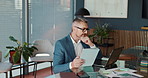 Tablet, laptop and businessman in office for thinking, trading and problem solving. Technology, reading or mature manager check stock price for investment decision, financial idea or planning project