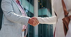 Closeup, handshake and business people in city, agreement 
 and b2b deal with thank you. Outdoor, employees and shaking hands for cooperation, greeting and onboarding with negotiation or partnership