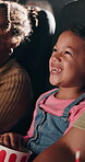 Laughing, movie and night with child in theater for relax, kids cinema production and film screening. Projector, cartoon and auditorium show with happy girl or audience for entertainment and event