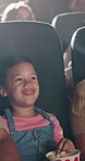 Laughing, movie and popcorn with child in theater for relax, kids cinema production and film screening. Projector, cartoon and auditorium show with happy girl or audience for entertainment and event