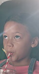 Girl, cinema or watching movie with drink or laughing for funny show, comedy or humor in dark theater. Child, kid or smile with sip or beverage for comic entertainment, suspense or fun motion picture