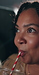 Movie, drink and happy woman in cinema audience for premiere and entertainment. Theatre, person drinking and suspense or shock of show, performance and watching film with beverage, spectator or straw