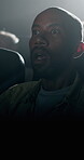 Man, cinema or horror with shock for scary movie, thriller or flashing light in dark theater. Male person, fright or dramatic experience with suspense for terrifying scene, nightmare or entertainment