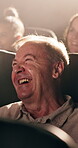 Senior, happy man and laughing with movie at cinema for comedy show, humor or entertainment. Elderly, male person or smile with funny joke or comic for performance or motion picture in dark theater