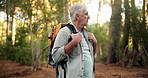 Fitness, senior man and hiking in forest for travel adventure, retirement hobby or sightseeing nature. Backpack, old person or trekking journey for cardio workout, fresh air or trail walking in woods