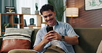 Sofa, man and laugh with smartphone for communication, reading message and text from online contact. Home, male person and social media with mobile for application, dating website and chat on couch