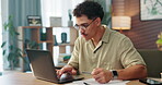 Home, man and typing with laptop for credit card, online shopping and transaction for payment. Office, male person and bills with digital for debit information, ecommerce and banking with happiness