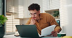 Frustrated man, laptop and kitchen with documents for finance, expenses or mortgage payments at home. Male person, debt or financial crisis with computer or paperwork for bills, invoices or loan