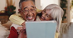Senior, hug or happy couple in home with tablet, love or news for renovation blog research in lounge. Talking, retirement or elderly people in interracial relationship together for interior decor