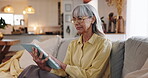 Tablet, scroll and confused with old woman on sofa for error, communication crisis and retirement. Spam, contact and glitch with senior person in living room at home for reading, research or online

