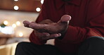Hands, massage and pain with senior man on sofa in living room of home for recovery or relief. Arthritis, carpal tunnel and osteoporosis with person closeup in apartment for cramp or inflammation