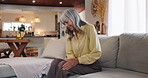 Senior woman, sofa and pain with knee injury for arthritis, joint inflammation or fibromyalgia at home. Elderly, female person or patient with sore leg, bone or nerve for osteoarthritis disease