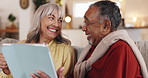 Couch, old couple or laughing with tablet movie, video and smile for funny joke in lounge. Comedy humor, relax and happy people in interracial relationship in house living room for streaming film