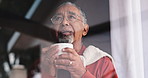 Senior, man and coffee with thinking by window for happy memory, daydreaming and peaceful in retirement. Elderly person, view and beverage in home with reflection, nostalgia and relax with wondering