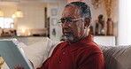 Tablet, typing and confused with old man on sofa for 404 error, communication crisis and retirement. Spam, contact and glitch with senior person in living room at home for reading, research or online