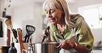 Cooking, smell and pot with old woman in kitchen for food recipe, nutrition and healthy diet. Meal prep, dinner planning and retirement with senior person and stir at home for aroma, dish or hunger