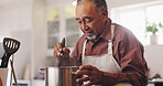 Cooking, steam and pot with old man in kitchen for food recipe, nutrition and healthy diet. Meal prep, dinner planning and retirement with senior person and stir at home for chef, dish or hunger