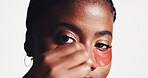 Face, skincare and black woman with eye patches in studio isolated on white background. Dermatology, beauty and cosmetics for female model with facial collagen mask for healthy skin and anti aging