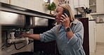 Emergency, leak and phone call with woman in kitchen of home for assistance, help or service. Communication, pipes and plumbing with person in apartment for conversation, maintenance or repair
