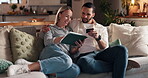 Credit card, online shopping and tablet with couple on sofa in living room of home together for ecommerce. App, payment or purchase with man and woman in apartment at night for internet consumerism