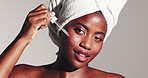 Happy, black woman or skincare with face serum in studio for facial or collagen on a white background. Portrait, female person or model with smile, pipette or drop for vitamin oil, skin glow or shine