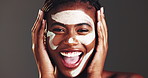Happy, black woman or studio with face mask for skincare or facial treatment on a gray background. Portrait, female person or model with smile, lotion or moisturizer for anti aging or skin protection