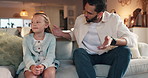 Discipline, father and talking to child on sofa for bad behavior, attitude problem and punishment for tantrum. Lesson, man and reprimand girl kid in home with discussion, teaching manners and advice
