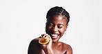 Skincare, happy and black woman with lemon in studio for organic, natural or facial treatment. Beauty, squeeze and African female person with citrus fruit for dermatology by white background