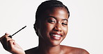 Makeup, face or black woman with mascara in sequence for cosmetic application on a white studio background. Portrait, female person or happy model with eyelash tool for beauty or volume on space