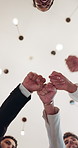 Fist bump, below and hands of business people in circle for teamwork, collaboration and partnership. Professional office, corporate diversity and men and women for connection, support and solidarity