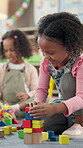 Kindergarten, children and girl with blocks for education, creative and cognitive development in class. School, students and kid with building toys for learning, motor growth or problem solving skill