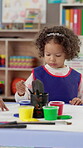 Learning, child student and painting for art at school with paintbrush, creativity and color picture. Education, girl or kid with activity for development with paint and paper for daycare artwork