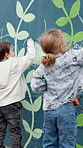 Chalk, drawing and kids at preschool for creativity, growth or skill development at mural wall. Education, students and boy children outdoor with art for activity, hobby or lesson at kindergarten.