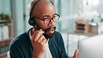 Computer, explain and support with black man in call center for assistance or feedback. Contact us, conversation and customer service with agency employee typing in workplace as virtual assistant