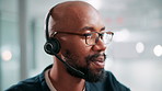 Call center, talk and face of black man at help desk for customer service or multilingual support agent. Consultant, speaking and assistance with headset for crm, language translation or contact us