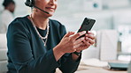 Hands, phone and texting at call center, office and typing with chat, web or customer support job. Person, consultant or agent with smartphone, headset or scroll with social media on break at company