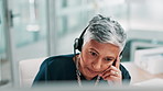 Call centre, tired and woman in office, headache or fatigue with stress, mental health or mistake. Mature person, burnout or employee with pain, exhausted or migraine with anxiety and glitch system