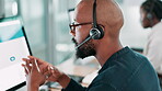 Call center, computer and black man consulting with headset for product advice, lead generation or assistance. Telemarketing agent, talking or microphone for inbound query, online sales or contact us