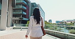 Back, corporate and woman walking in city for travel, journey and morning commute as relator. Female person, sidewalk and adventure with professional career, trip and routine for architecture view